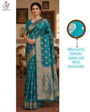 Elegant teal blue silk saree with silver zari motifs and a detailed border. Perfect for weddings, receptions, and festive occasions. Elegant teal blue silk saree with silver zari motifs and a detailed border. Perfect for weddings, receptions, and festive occasions.
