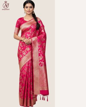 This pink Banarasi silk saree is made for women who love tradition with elegance. The saree is woven with golden zari floral motifs all over and has a rich border and pallu. The bright pink colour adds charm, while the golden shine makes it perfect for special occasions. The fabric is soft and drapes beautifully, giving you comfort and a royal look at the same time. Wear it for weddings, festive functions, or family gatherings, and you will surely stand out. Pair it with gold jewellery to complete your festive look. ✨ Highlights: Fabric: Premium Banarasi Silk Colour: Bright Pink with golden zari Work: Floral zari weaving with border & pallu Occasion: Wedding, festive wear, family functions Look: Rich, traditional, and graceful Banarasi Silk Saree with Golden Zari Border & Floral Weaving